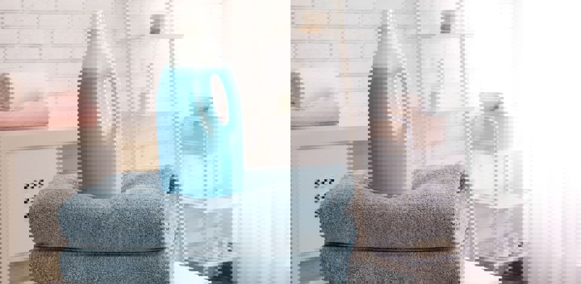 Laundry Detergent Bottle On Towels Min